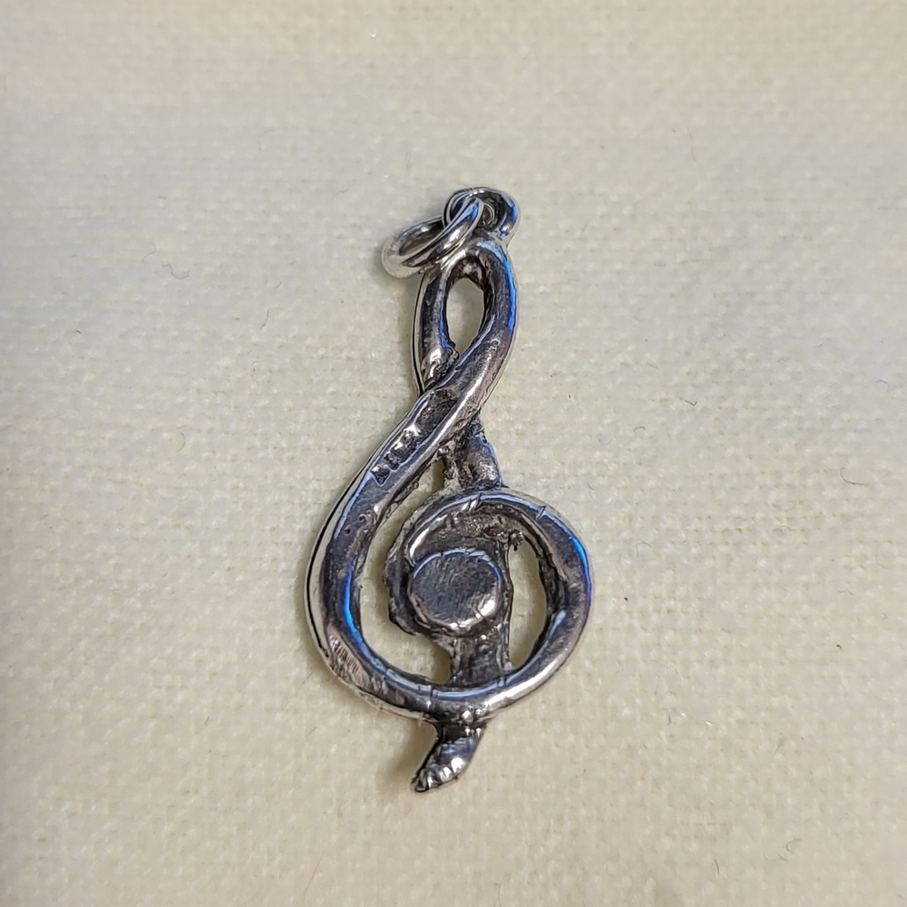 Silver Treble Clef Pendant.‎ Source Unknown.
